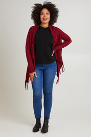 Model Olivia wearing size S of the Long Sleeve Knit Poncho in colour Burgundy (Red), from the front, showing the whole outfit