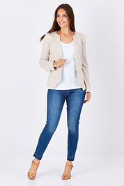 Model Anna wearing the Persuit Jacket in colour Cream, from the front, showing the whole outfit