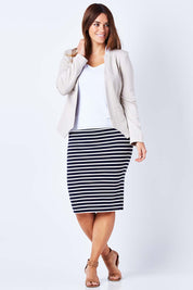 Model Laura wearing the Persuit Jacket in colour Cream, from the front, showing the whole outfit