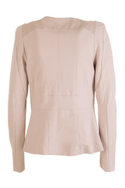 Product shot of the Persuit Jacket in colour Cream, from the back