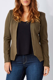 Model Laura wearing the Persuit Jacket in colour Khaki (Green), from the front, cropped image