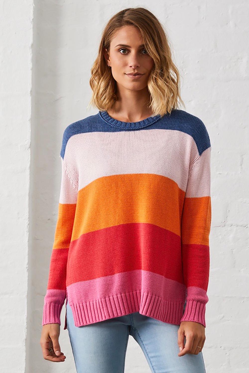 A model wearing the Mega Stripe Pullover in colour Bubblegum (Pink), from the front, showing the whole outfit
