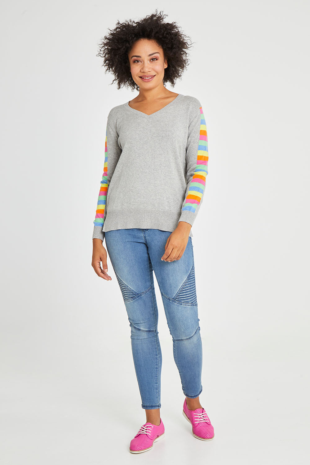 Model Olivia wearing size S of the Ladder Sleeve Jumper in colour Heathercom (Grey), from the front, showing the whole outfit