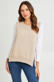 Model Madeline wearing size S of the Essential Vest in colour Oat, from the front, cropped image