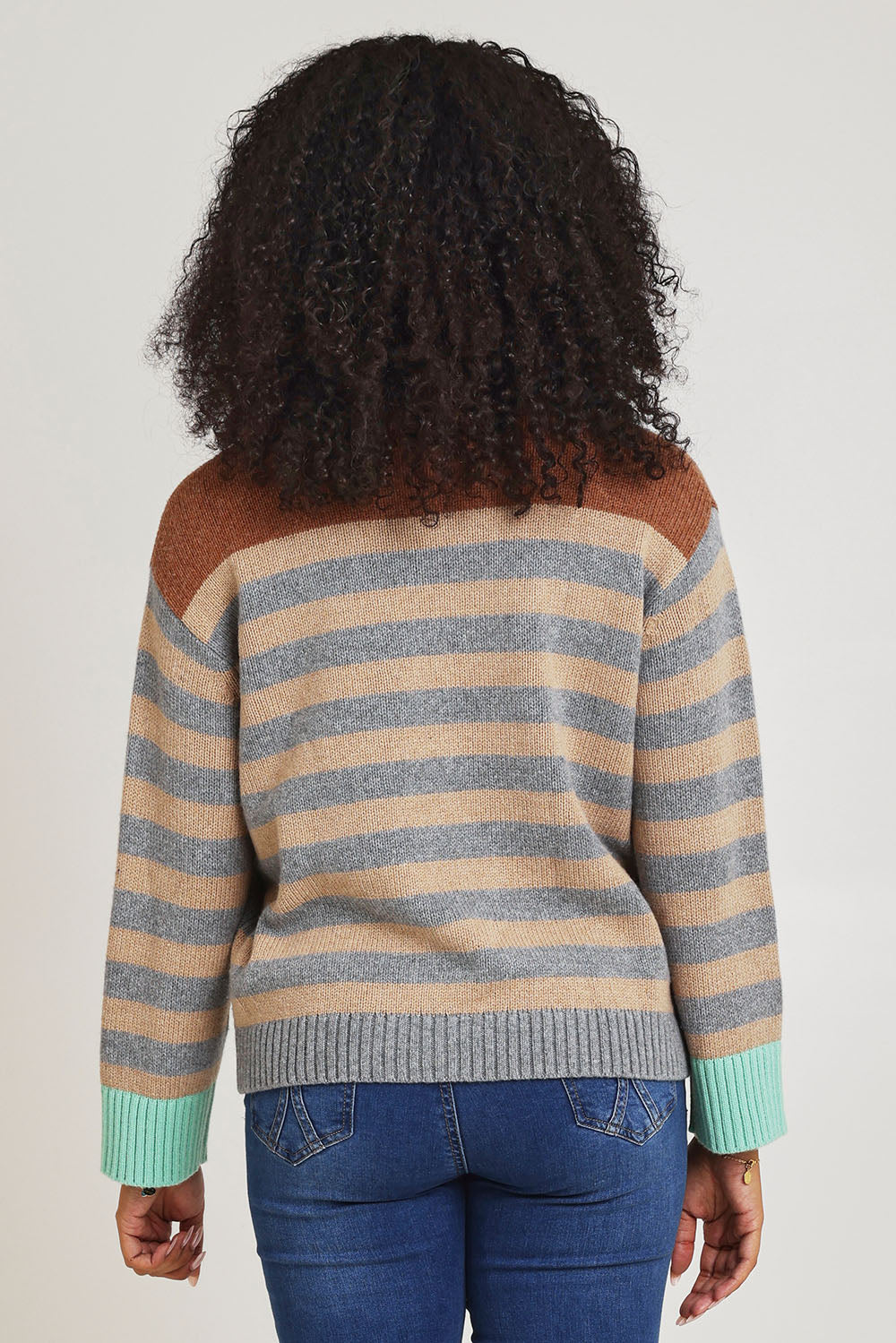 Model Ziara wearing size S of the Fairisle Cotton Merino Jumper in colour Goose, from the back