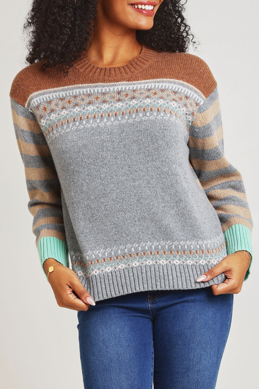 Model Ziara wearing size S of the Fairisle Cotton Merino Jumper in colour Goose, from the front, cropped image