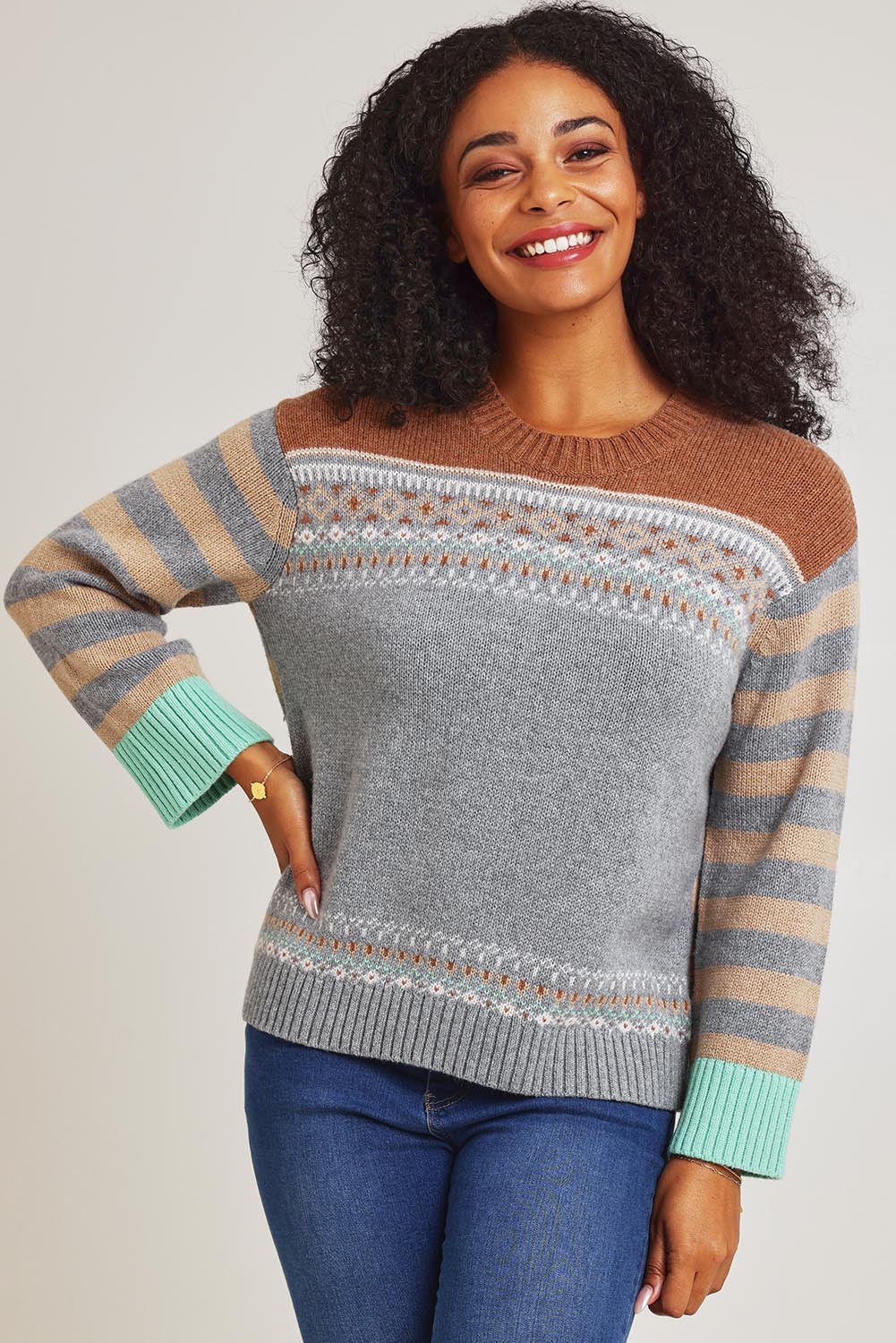 Model Ziara wearing size S of the Fairisle Cotton Merino Jumper in colour Goose, from the front, cropped image