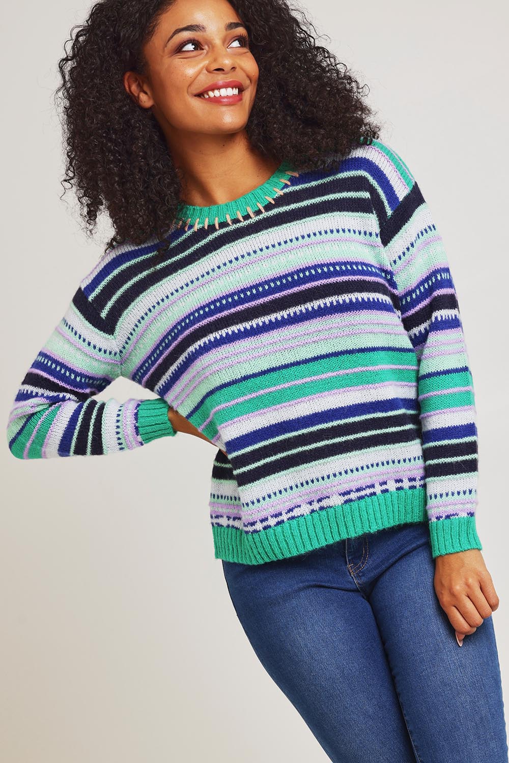 Model Ziara wearing size S of the Stripe Merino Jumper in colour Green (Green), from the front, cropped image