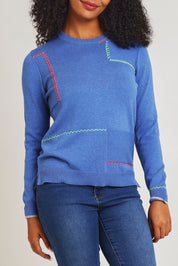 Model Ziara wearing size S of the Hancraft Cotton Cashmere Crew in colour Chambray (Blue), from the front, cropped image