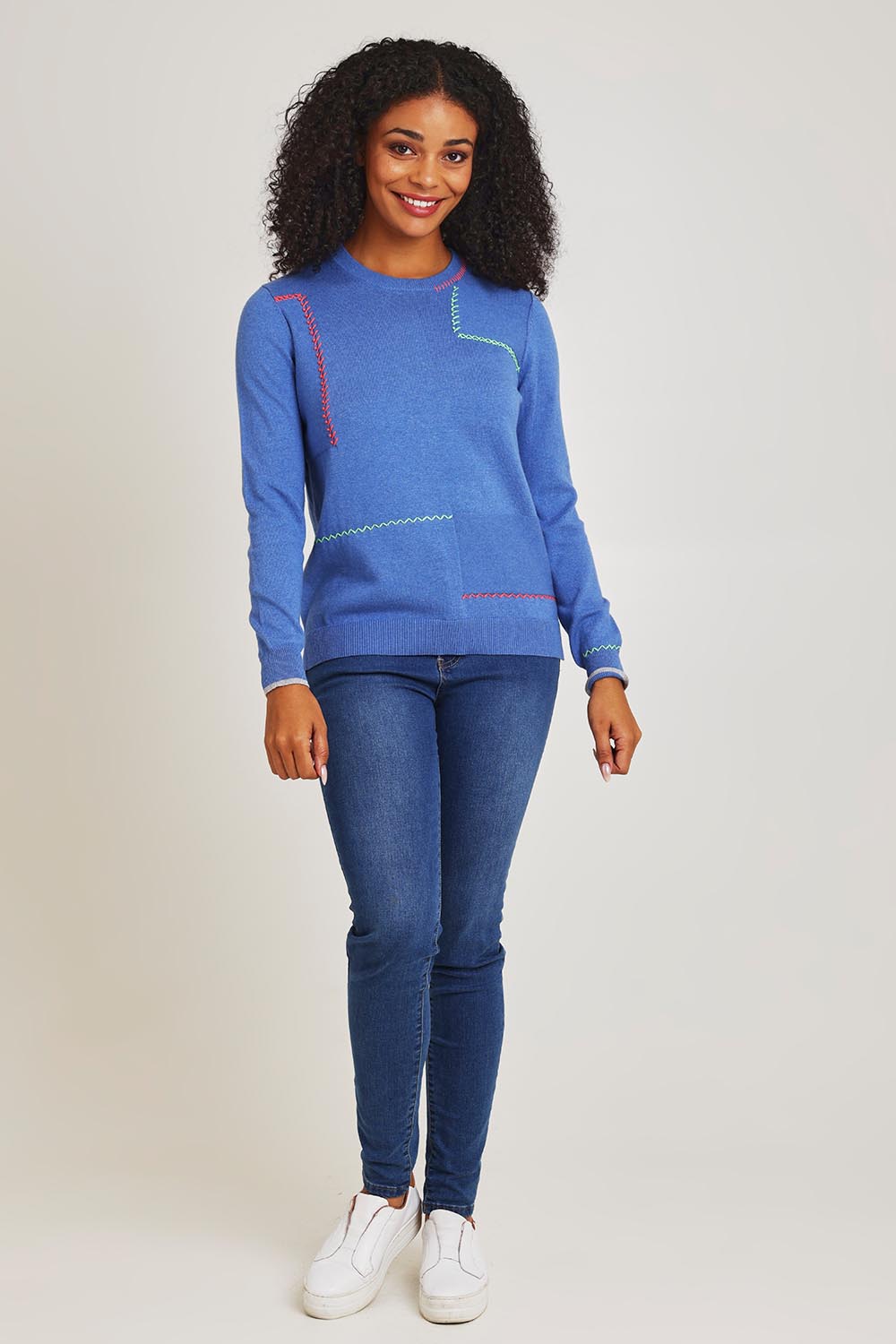 Model Ziara wearing size S of the Hancraft Cotton Cashmere Crew in colour Chambray (Blue), from the front, showing the whole outfit