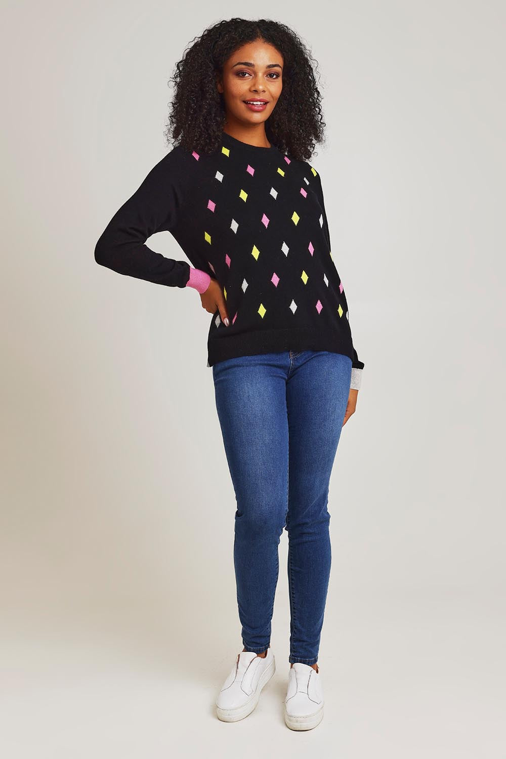 Model Ziara wearing size S of the Magestic Cotton Cashmere Crew in colour Black (Black), from the front, showing the whole outfit