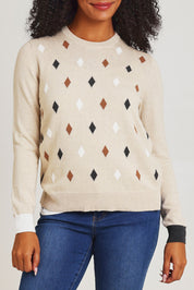 Model Ziara wearing size S of the Magestic Cotton Cashmere Crew in colour Oat, from the front, cropped image