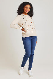 Model Ziara wearing size S of the Magestic Cotton Cashmere Crew in colour Oat, from the front, showing the whole outfit