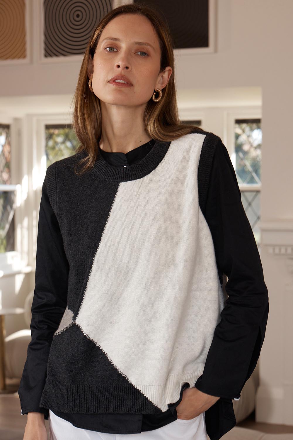A model wearing the Diamond Dapper Cotton Cashmere Vest in colour Charcoal, from the front, showing the whole outfit