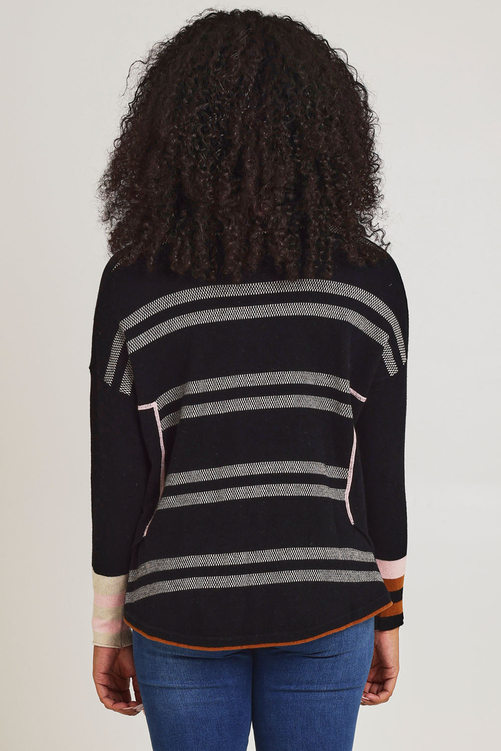 Model Ziara wearing size S of the Birdseye Cotton Cashmere Jumper in colour Black (Black), from the back
