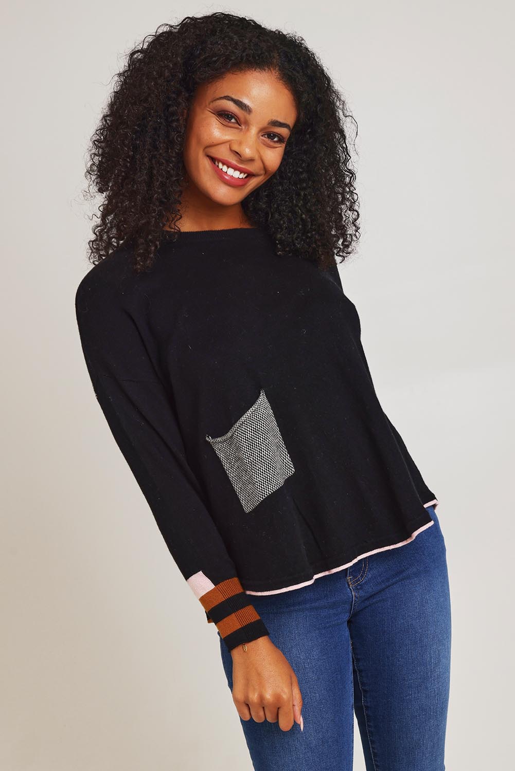 Model Ziara wearing size S of the Birdseye Cotton Cashmere Jumper in colour Black (Black), from the front, cropped image