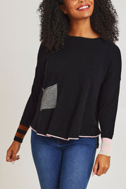 Model Ziara wearing size S of the Birdseye Cotton Cashmere Jumper in colour Black (Black), from the front, cropped image