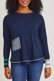 Model Ziara wearing size S of the Birdseye Cotton Cashmere Jumper in colour Denim (Blue), from the front, cropped image