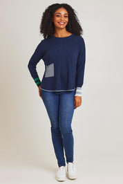 Model Ziara wearing size S of the Birdseye Cotton Cashmere Jumper in colour Denim (Blue), from the front, showing the whole outfit