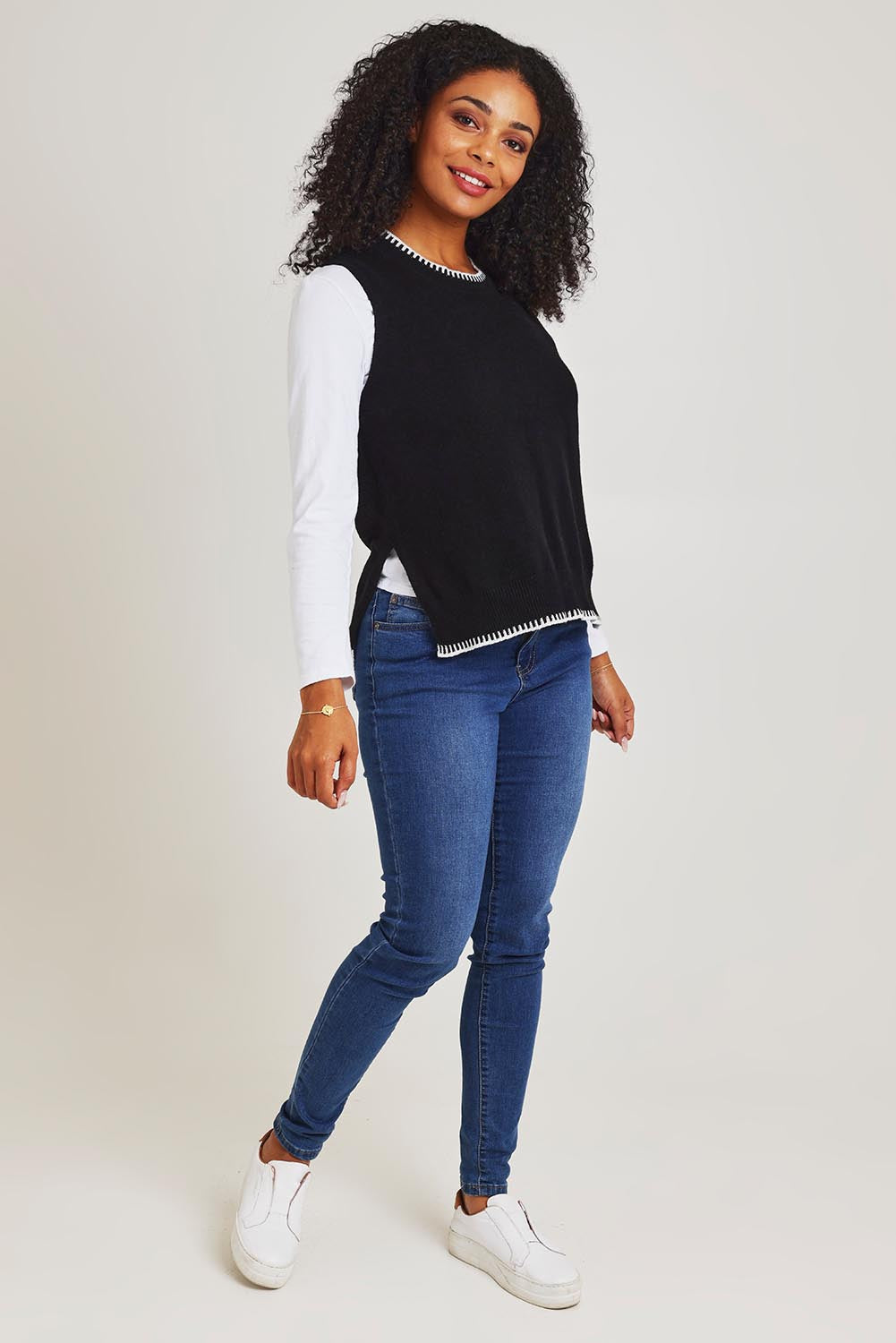 Model Ziara wearing size S of the Essential Two Tone Cotton Cashmere Vest in colour Black (Black), from the front, showing the whole outfit