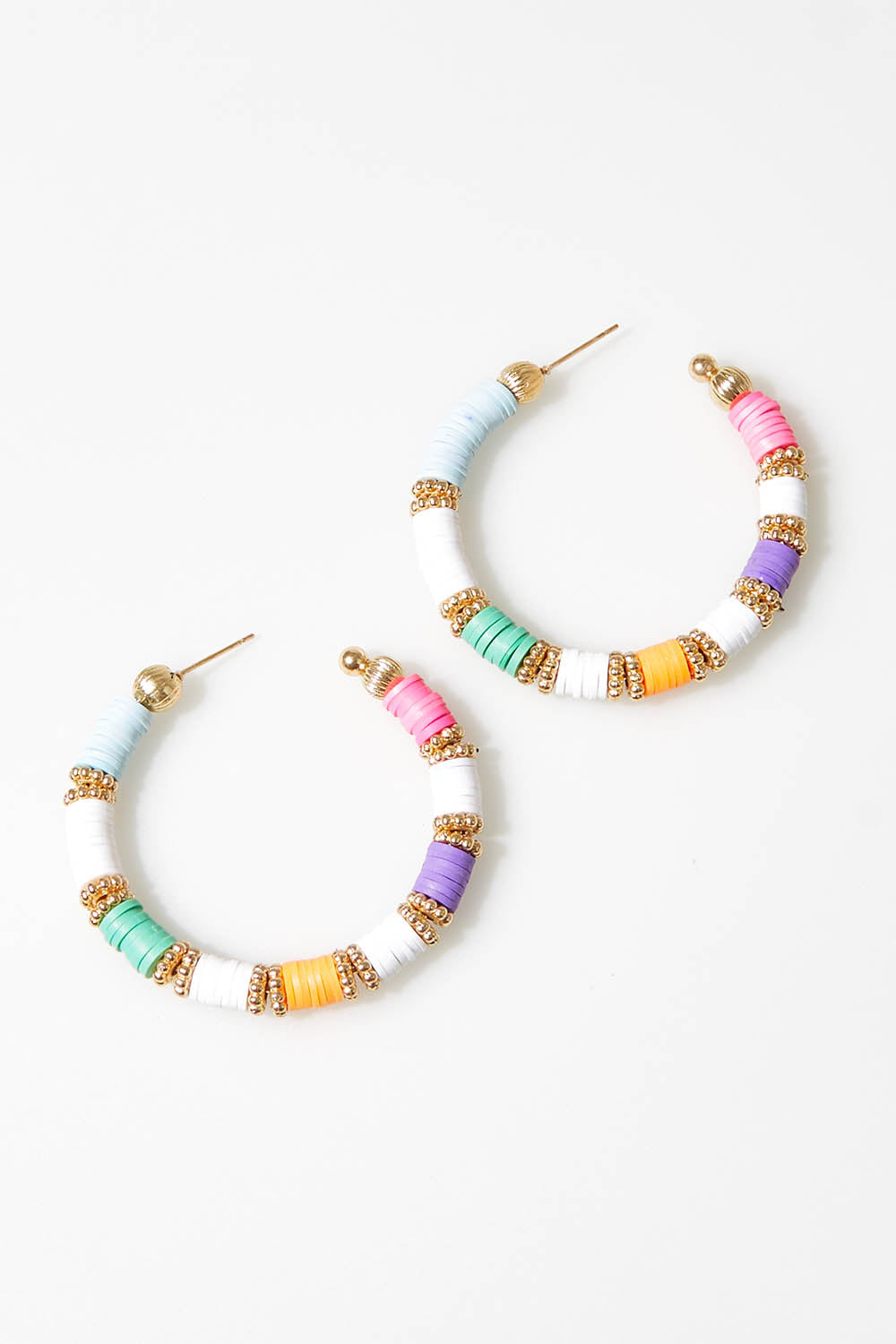 A model wearing size OneSize of the Mimi Beaded Hoop Earring in colour Whitemulti (White), from the front, showing the whole outfit