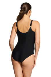A model wearing the Freesia Adjustable Scoopback One Piece in colour Freesia (Black), from the back