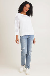 Model Ziara wearing size S of the Hearts On My Sleeve Cotton Knit in colour White (White), from the front, showing the whole outfit